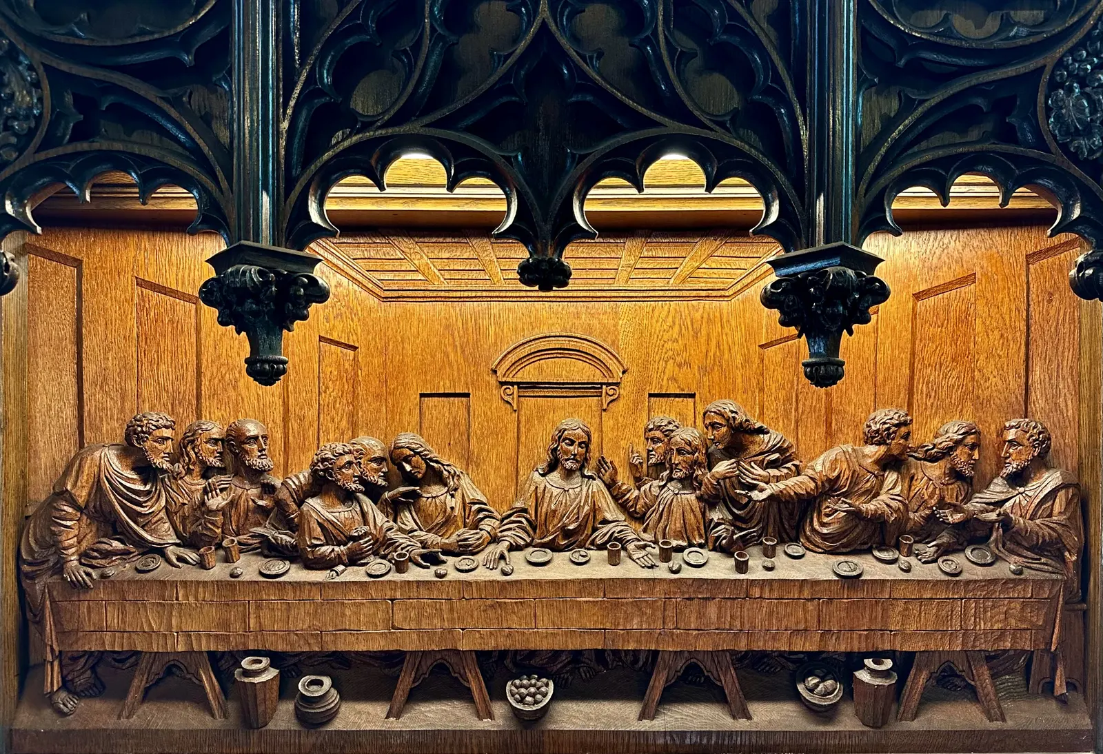 Carved Last Supper bas-relief behind the altar